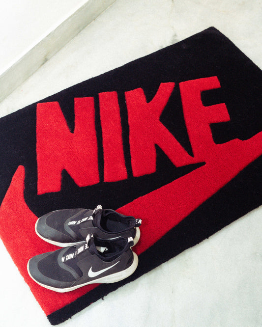 Nike red and black sports rug